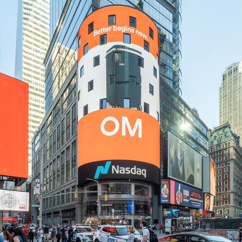 The round Nasdaq MarketSite tower covered in screens in Times Square
