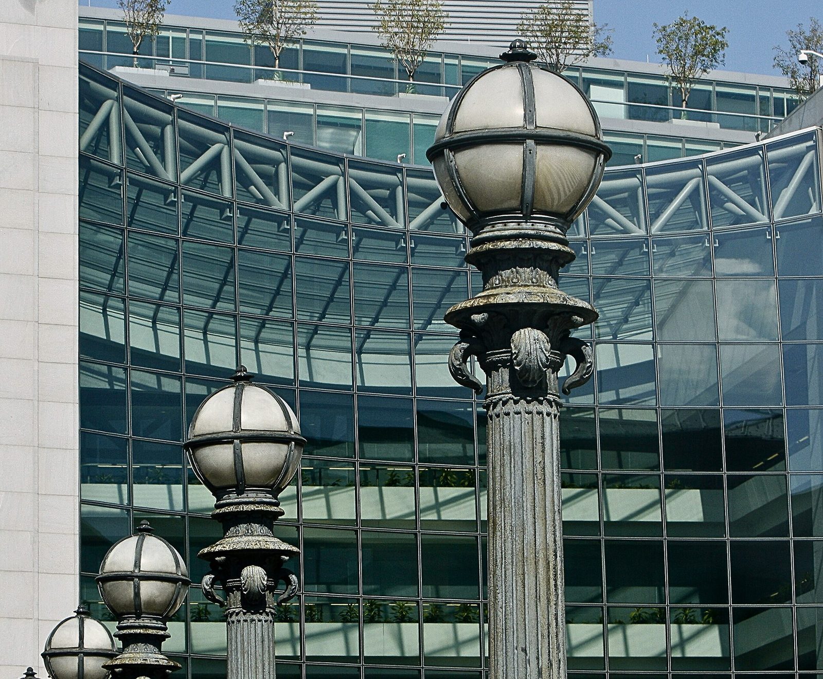 Street lamps in front of the glass facade of the SEC headquarters