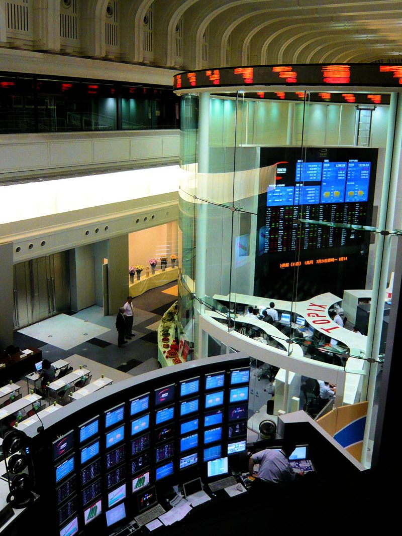 Screens and a glass booth inside the Tokyo Stock Exchange